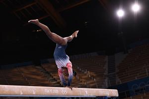 USA's Simone Biles competes in the artistic gymnastics women's balance beam final of the Tokyo 2020 Olympic Games at Ariake Gymnastics Centre in Tokyo on August 3, 2021.