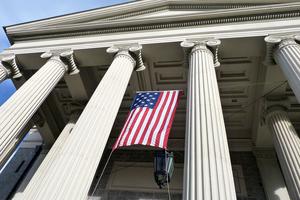 A 15-starred “Star-Spangled Banner” hangs on the facade of the historic Baltimore Basilica, the first cathedral built in the United States.