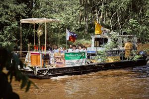 A floating ‘church’ carries Jesus in the Blessed Sacrament down the Bayou Teche.