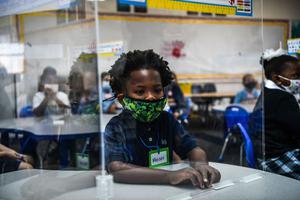 Student wear facemasks as they attend their first day in school after summer vacation at the St. Lawrence Catholic School  in north of Miami, on August 18, 2021.