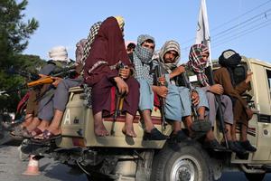 Taliban fighters in a vehicle patrol the streets of Kabul on August 23, 2021 as in the capital, the Taliban have enforced some sense of calm in a city long marred by violent crime, with their armed forces patrolling the streets and manning checkpoints.