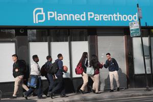 Pedestrians walk past a Planned Parenthood facility on May 18, 2018, in Chicago. Pedestrians walk past a Planned Parenthood facility on May 18, 2018, in Chicago.