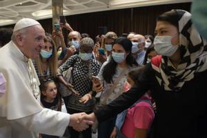 Pope Francis greets people after a documentary screening at the Vatican’s Paul VI Hall on Sept. 6.