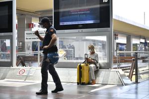 A police officer stands inside Porta Nuova Station on Sept. 1 in Turin, Italy. Italy has imposed a 'Green Pass' for the use of means of transport such as buses, trains, airplanes and ferries as of Sept. 1.