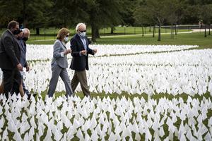 Speaker of the House Nancy Pelosi (D-CA) tours ‘In America: Remember,’ a public art installation on the National Mall in Washington, D.C., on Tuesday. The installation includes more than 660,000 small plastic flags — equal to the number of Americans who have died due to COVID-19 in the past 18 months, or the number of children killed through abortion in the U.S. in the past nine months.