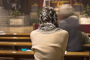 Photo illustration of a woman attending a Traditional Latin Mass.