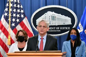 U.S. Attorney General Merrick Garland (c), Deputy Attorney General Lisa O. Monaco (l) and Associate Attorney General Vanita Gupta (r) hold a news conference to announce a lawsuit against Texas at the Department of Justice in Washington on Sept. 9.