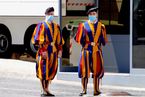 Two Swiss guards pose for a photo wearing masks amid the COVID pandemic.