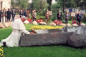 Pope St. John Paul II prays June 14, 1987, in Warsaw in front of the church of Saint Stanislas at the tomb of Blessed Jerzy Popiełuszko. The Solidarity movement chaplain was kidnapped and murdered Oct. 19, 1984. Three secret police officers were found responsible for the murder in 1985 and sentenced to 25, 15 and 14 years in prison. Their immediate superior was sentenced to 25 years in jail.