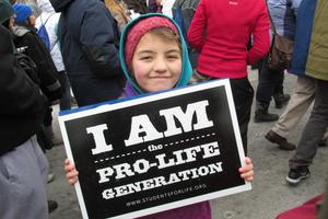 A girl holds a sign at the March for Life rally in Washington, D.C.