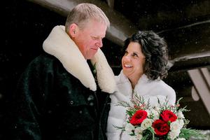 Sarah Beth Dippel (r) and her husband, Cris on their wedding day outside of the Chapel of the Sacred Heart in Grand Teton National Park.