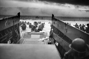 A landing craft from the U.S. Coast Guard-manned USS Samuel Chase disembarks troops of Company A, 16th Infantry, 1st Infantry Division (the Big Red One) onto Omaha Beach on June 6, 1944.