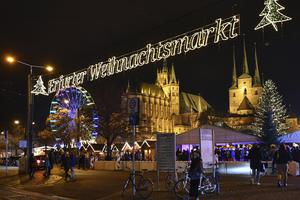 Lights shine at Erfurt's Christmas market on Cathedral Square below St. Mary's Cathedral and St. Severus Church Nov. 23 in Thuringia, Germany. Austrian and German dioceses are implementing a measure that will prohibit unvaccinated people from attending Mass due to the recent spike in cases.