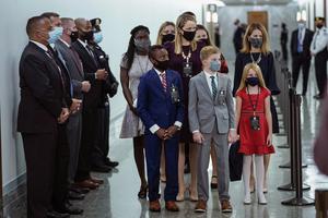 Accompanied by her seven children, Amy Coney Barrett arrives Oct. 12, 2020, for her Senate Judiciary Committee confirmation in Washington, DC.