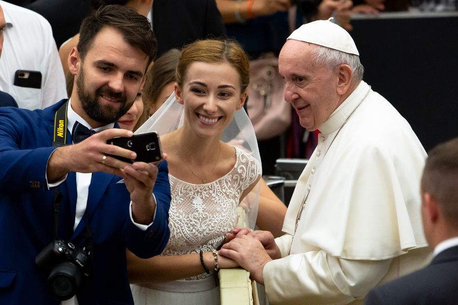 Pope Francis greets pilgrims during the Wednesday general audience inside the Vatican's Paul VI Hall on Aug. 21, 2019.