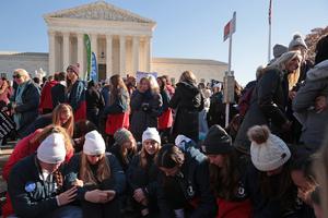 Students from Liberty University pray in front of the U.S. Supreme Court as the justices hear oral arguments in 'Dobbs v. Jackson Women's Health,' a case about a Mississippi law that bans most abortions after 15 weeks,  Dec. 1 in Washington, D.C.