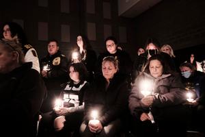Students, parents, teachers and community members gather for a vigil at Lake Point Community Church following a shooting at Oxford High School on Nov. 30 in Oxford, Michigan. Catholic clergy also prayed with the community. Four people were killed and six others wounded by the alleged shooter, a 15-year-old student who is now in police custody.