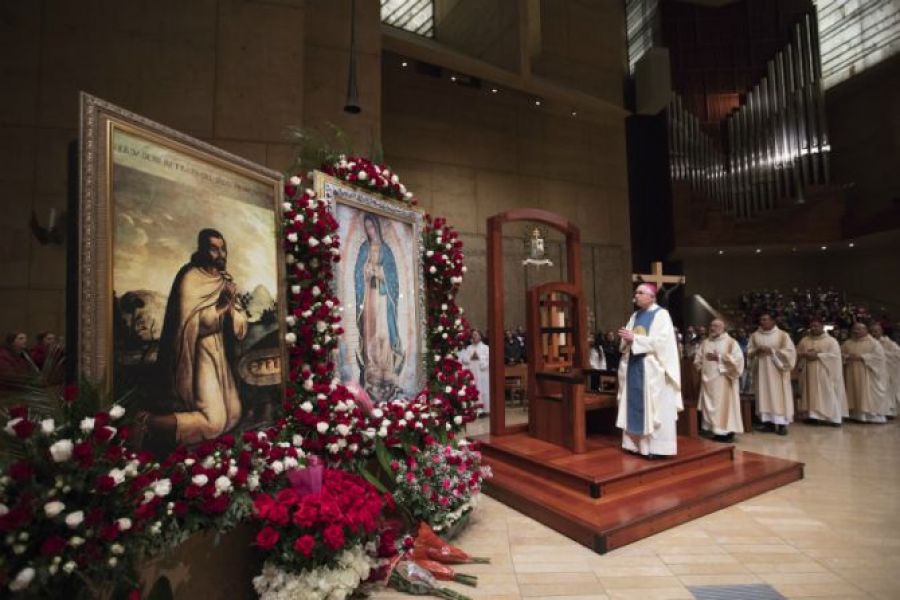 Archbishop Jose Gomez of Los Angeles venerates an image of Our Lady of Guadalupe at the Catheral of Our Lady of the Angels, Dec. 12, 2017.