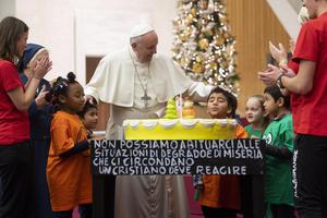 Pope Francis received a birthday cake a day before his actual birthday during an audience with volunteers and the children and their parents who are assisted by the "Santa Marta" Pediatric Dispensary in the Vatican, Dec. 16 2018.