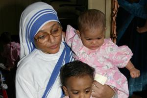 Missionary of Charity sister cares for unwanted children at  Nirmala Shishu Bhavan  orphanage in Kolkata, India.