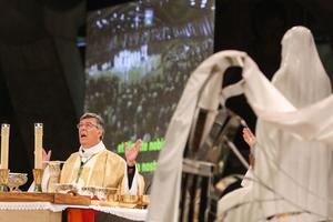 Former Archbishop of Paris Michel Aupetit leads a mass which brought together 9000 pilgrims in the Pie X basilica to commemorate the Assumption of the Virgin Mary on August 15, 2021 in Lourdes, southern France.