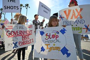 People demonstrate against COVID-19 vaccine mandates for students in Huntington Beach, California, on Jan. 3.