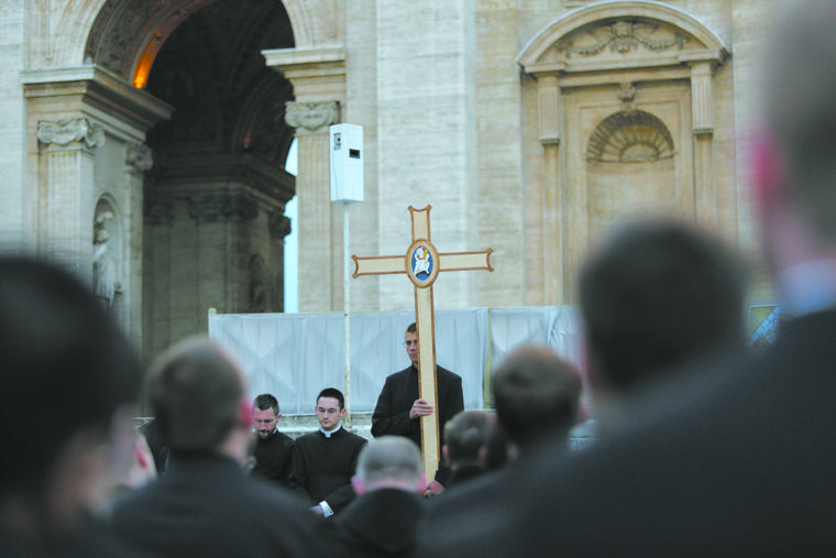 Above, seminarians from the North American College in Rome pray the Rosary in St. Peter’s Square on March 13, 2016.