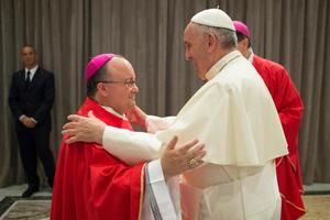 Archbishop Charles Scicluna of Malta greets Pope Francis.