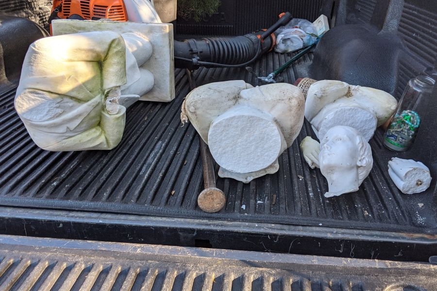 Removal of the remains of statues destroyed at the grotto of Nativity parish in Burke, Va., Jan. 25, 2022.