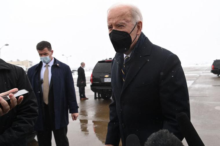 President Joe Biden speaks to the press as he arrives at Allegheny County Airport in West Mifflin, Pennsylvania, January 28, 2022, as he travels to Pittsburgh to speak on the economy.