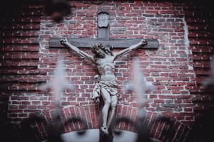 A crucifix hangs outside Bernardine Church and monastery in Lviv.