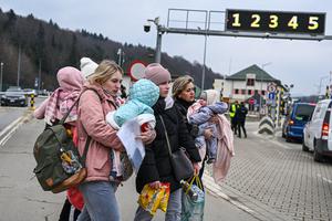 Women who fled the war in Ukraine carry their babies after crossing the Polish-Ukrainian border on March 7 in Kroscienko, Poland. The country was already home to a large Ukrainian population, making Poland a major destination for refugees from the current war.