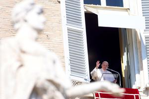 Pope Francis delivers his Sunday Angelus blessing from his studio overlooking St. Peter's Square on March 13, the ninth anniversary of his election to the papacy.