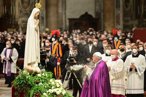 Pope Francis swings a thurible of incense before a statue of Our Lady of Fatima, during a penitential celebration service in St. Peter's Basilica on March 25, 2022, during which he is to consecrated Russia and Ukraine to the Immaculate Heart of Mary.