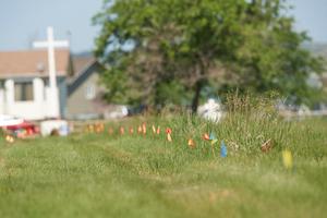 Flags mark the unmarked graves of more than 750 who were buried on the site of the former Marieval Indian Residential School in Cowessess First Nation, Saskatchewan, June 25, 2021. Pope Francis will meet with representatives of the First Nations on March 28 and 31 and April 1.