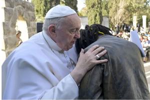 Pope Francis embraces Daniel Jude Oukeguale, who detailed his escape from Nigeria, during the Pope's visit to an immigration reception center in Hal Far, Malta, on April 3.