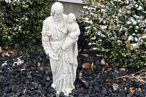 A statue of St. Joseph stands at the home of the writer
