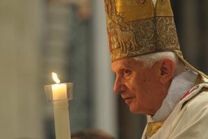 Pope Benedict XVI holds the Pascal Candle at the Easter Vigil Mass in St. Peter's Basilica April 7, 2012. The Pope Emeritus will turn 95 on Holy Saturday.