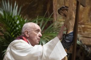 Pope Francis presides over the celebration of the Lord’s Passion on Good Friday in St. Peter’s Basilica on April 2, 2021. The Via Crucis returns to the Colosseum in Rome this year.
