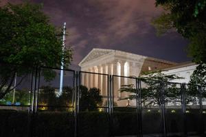 The Supreme Court is seen past un-scalable fencing in Washington, DC, early on May 5, 2022.