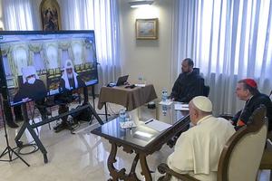 Pope Francis, with Cardinal Kurt Koch, prefect of the Vatican’s Pontifical Council for Promoting Christian Unity (r), and a translator attend a video call with Russian Orthodox Patriarch Kirill, at right on the monitor, and Metropolitan Hilarion, March 16.