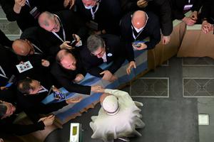 Pope Francis greets the Missionaries of Divine Mercy in the Paul VI hall at the Vatican on April 25.