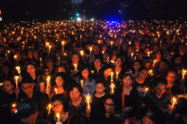 Protesters hold up a lighted candles to show solidarity in Bandung, Indonesia, on May 13, 2017, for the release of Jakarta’s governor Basuki Tjahaja Purnama, better known as “Ahok.” Ahok was jailed for two years after being found guilty of blasphemy, in a decision that stoked concerns over religious intolerance in the world’s most populous Muslim-majority nation.