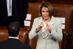 House Minority Leader Nancy Pelosi, D-Calif., talks with fellow representatives before Australian Prime Minister Julia Gillard address a joint meeting of the U.S. Congress at the U.S. Capitol March 9, 2011 in Washington, DC. Pelosi is wearing ashes on her forehead because it is Ash Wednesday, the first day of the Lenten season in the Catholic Church.