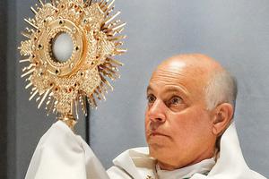 San Francisco Archbishop Salvatore Cordileone holds the monstrance containing the Blessed Sacrament in 2021.