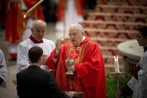 Cardinal Angelo Sodano distributes Communion during the Mass for the election of a new pope, in St. Peter's Basilica on March 12, 2013, before entering the Sistine Chapel for the papal conclave.