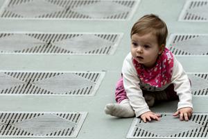 A baby sits on the floor at the Wednesday papal general audience inside the Paul VI Hall at the Vatican on Jan. 29, 2020. A baby sits on the floor at the Wednesday papal general audience inside the Paul VI Hall at the Vatican on Jan. 29, 2020.