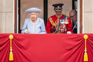 Queen Elizabeth II and Prince Edward, Duke of Kent watch from the balcony at Buckingham Palace for the Trooping the Colour ceremony parade on June 2, 2022 in London, England.