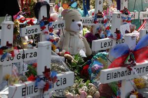 Wooden crosses are placed at a memorial at Robb Elementary School June 1, 2022 in Uvalde, Texas. 19 students and two teachers were killed on May 24 after an 18-year-old gunman opened fire inside the school. Wakes and funerals for the 21 victims are scheduled throughout the week.