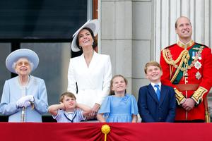 L to R: Queen Elizabeth II; Prince Louis of Cambridge; Catherine, Duchess of Cambridge; Princess Charlotte of Cambridge; Prince George of Cambridge; and Prince William, Duke of Cambridge; watch a flypast from the balcony of Buckingham Palace during Trooping the Color on June 2 in London during the Platinum Jubilee of Elizabeth II to mark the 70th anniversary of her accession to the throne.